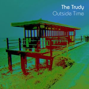 Cover of "Outside Time" by The Trudy. A psychedelic-coloured image of a seaside shelter on a short platform by the beach. The floorboards look reflective, so it must have been a rainy day. Some tufts of grass and other plants are by the side of the promenade, on a bank going down to the beach. Small pools of seawater are seen standing below the platform. A clear sky above is blue, but it might have been grey before the tinting was done.